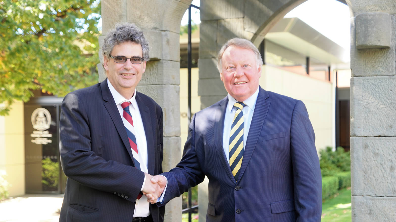 Chairperson of The Hutchins School Board, Professor Marcus Haward congratulates Headmaster, Mr Warwick Dean on the announcement of his retirement (large)