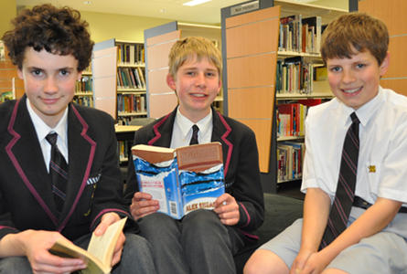 Middle School students Max McLaughlin, Johnathon Clark-Hansen and Stuart Carnaby practise their prose performances in the Nettlefold Library.