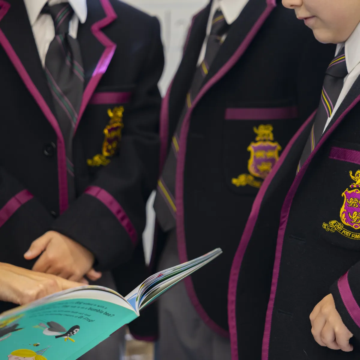 Hutchins students reading a book.