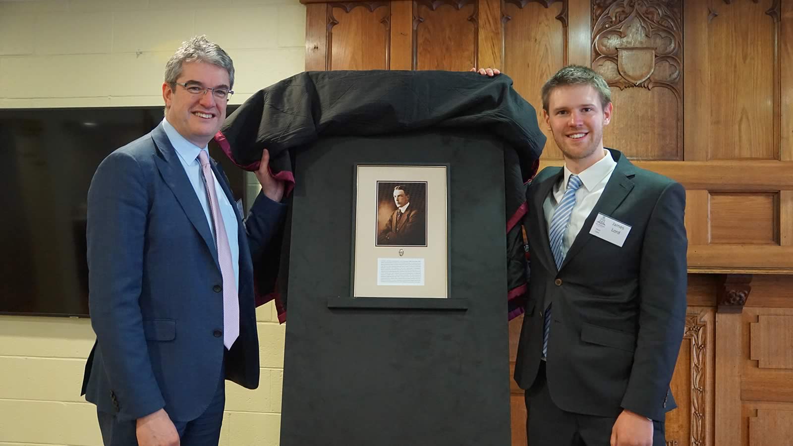 Mr Gene Phair (Chairperson of the Board) and Mr James Lord unveiling the ‘Hutchins Lion’ for 2019, Clive Errol Lord.