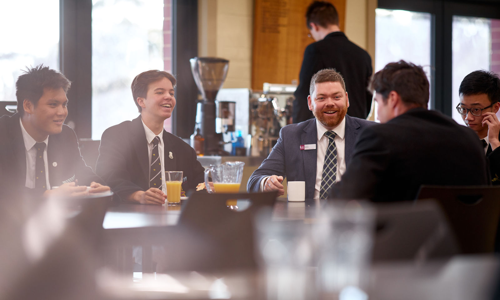 Mr Fraser Bolton (Head of Boarding) at breakfast with students