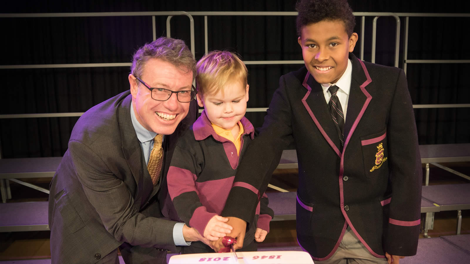 President of the Hutchins School Old Boys Association Mr Tim Munro (’82) with Edward Berry (Pre-Kindergarten) and Austin Douglas (Year 6).