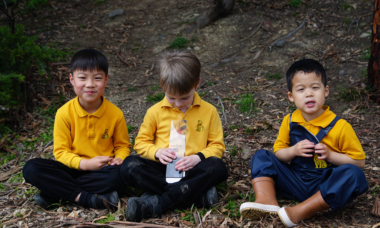 Jayden Huang, Samuel Porter and Ethan Yu with Kindicare Award.