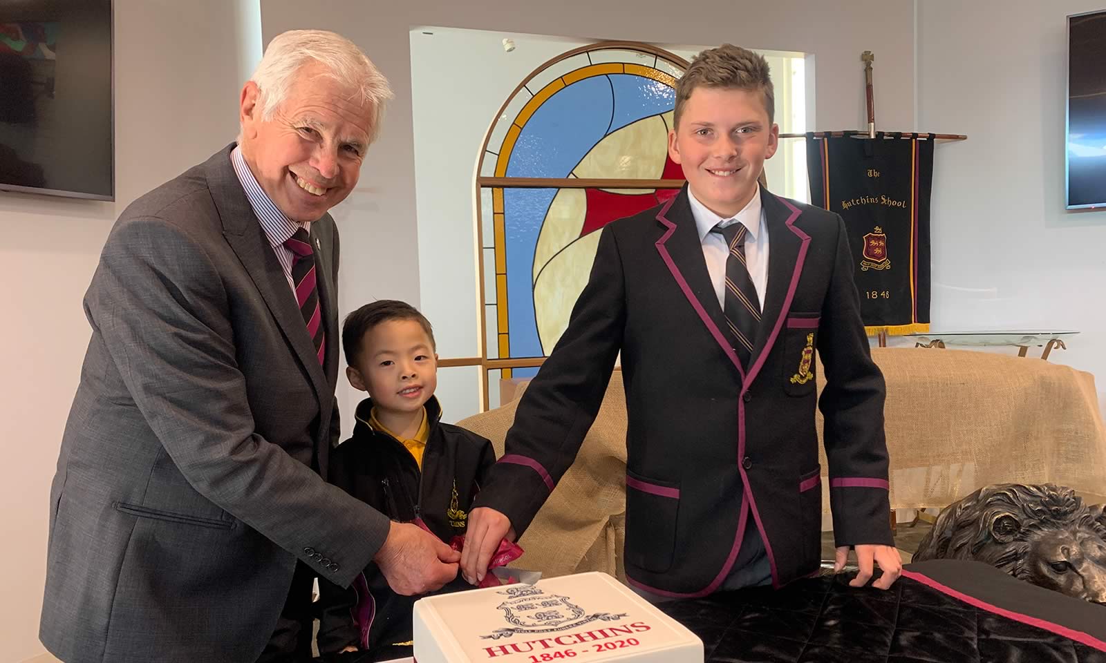 Mr Barrie Irons (President of the Hutchins School Old Boys’ Association), Damian Chen (Pre-Kindergarten) and Nicholas Badenach (Year 6).