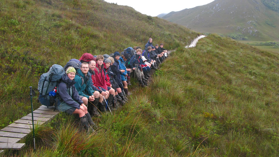 Walkers take a break on the way to Melaleuca from Cox's Bight.