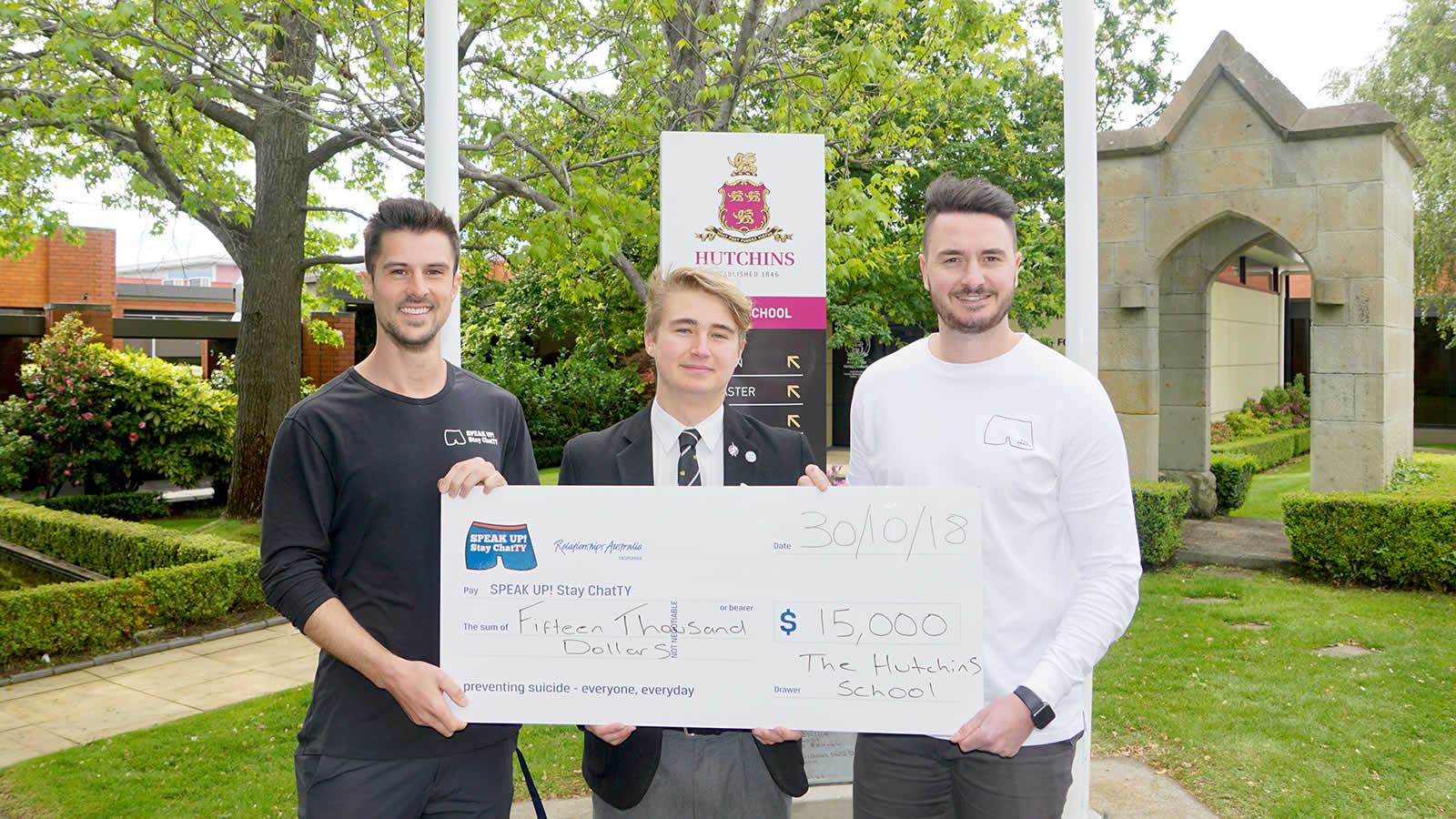 Fergus Charles (School Captain) presenting the cheque to James Rice (’05) and Mitch McPherson from SPEAK UP! Stay ChatTY.