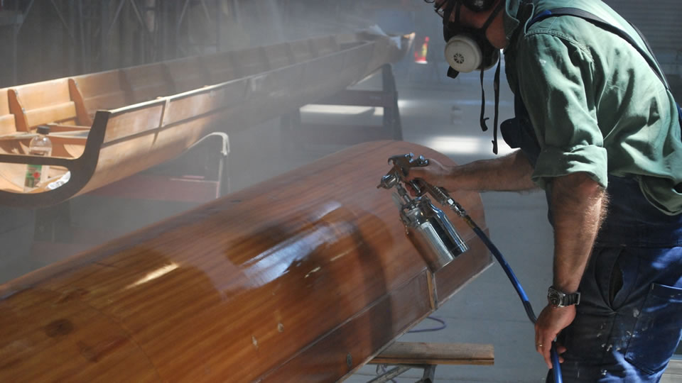 Mick Casey applying the first coat of varnish.