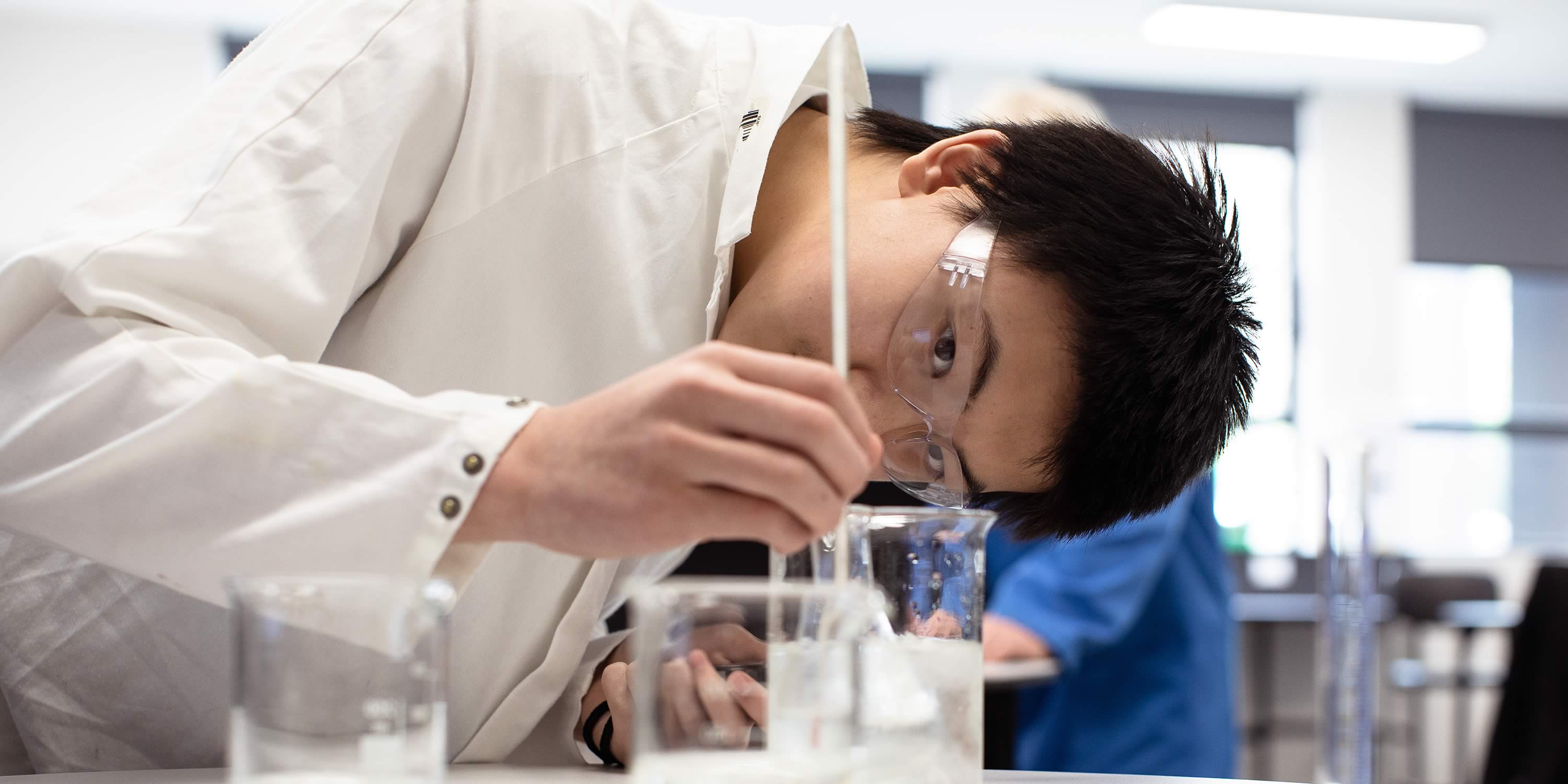 Student conducting experiment in a science class